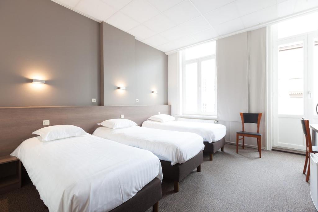 Postel nebo postele na pokoji v ubytování Hotel Loreto