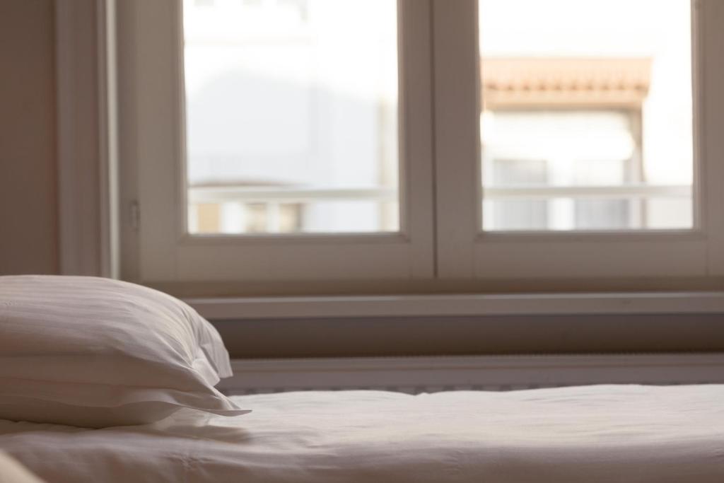 Postel nebo postele na pokoji v ubytování Hotel Loreto
