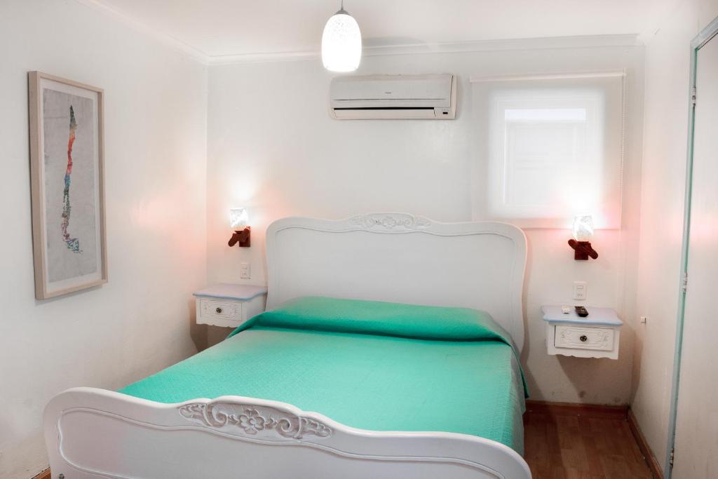 Postel nebo postele na pokoji v ubytování Hostal Casa Aborigen