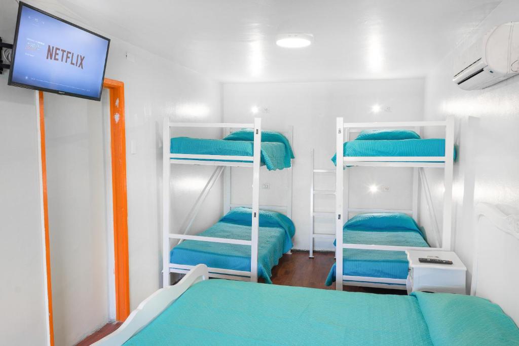 Postel nebo postele na pokoji v ubytování Hostal Casa Aborigen