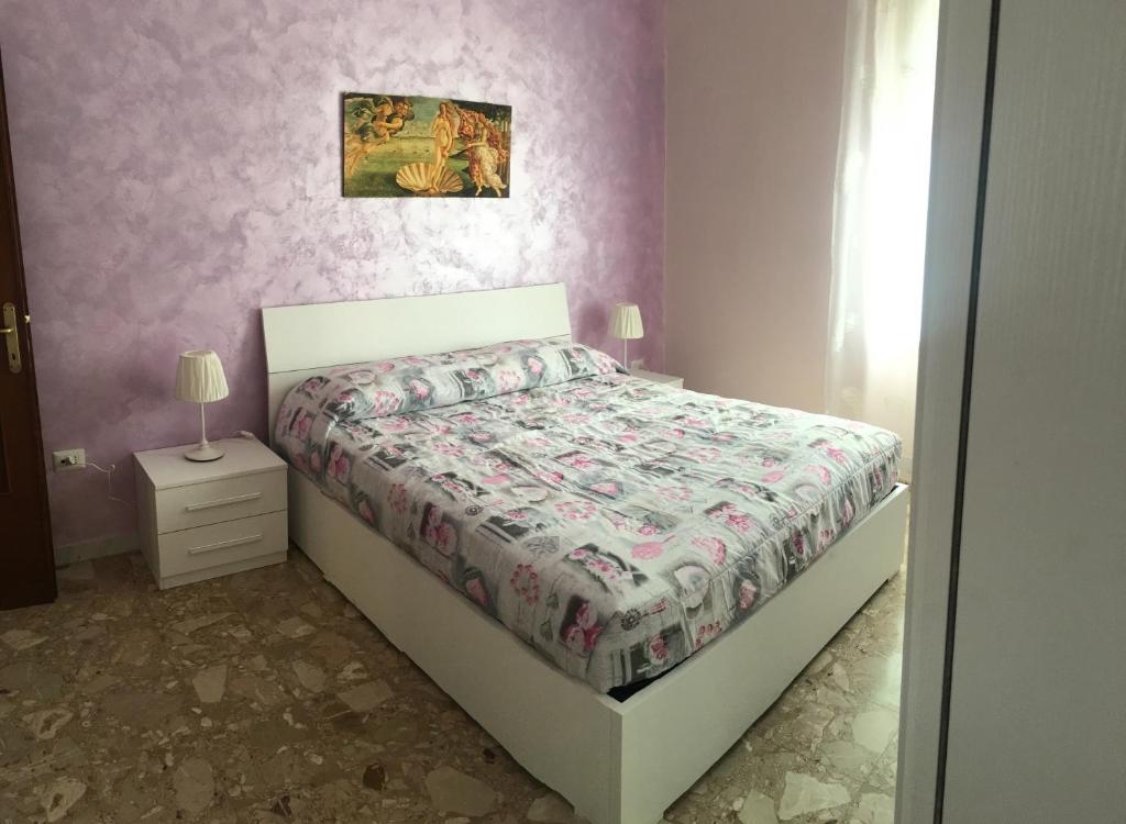 Łóżko lub łóżka w pokoju w obiekcie Appartamento - Casa vacanza Nonna Grazia