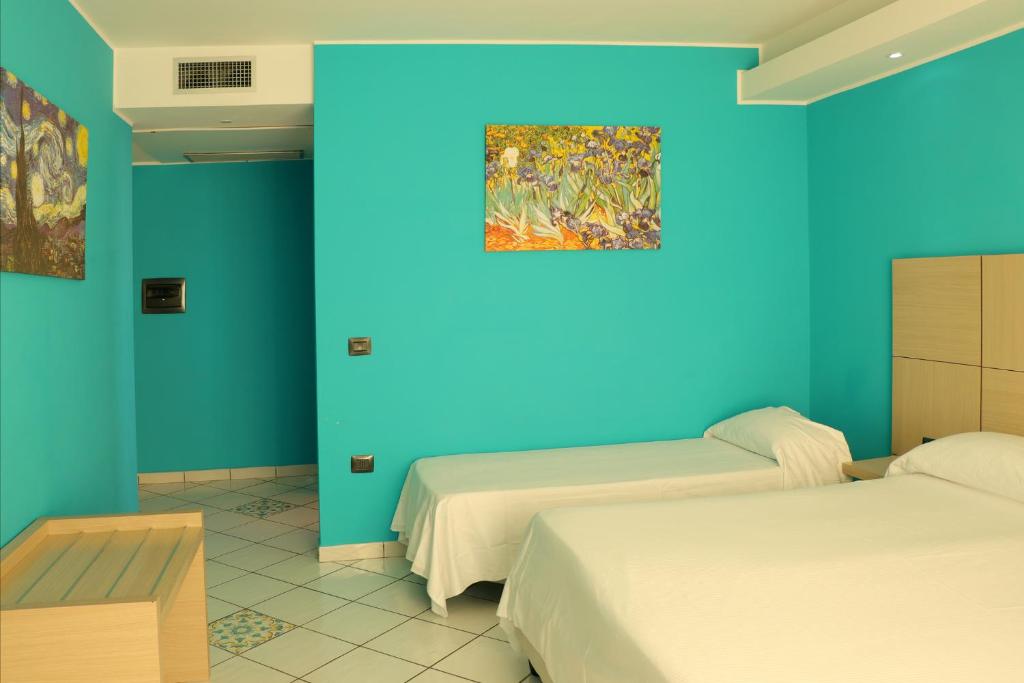 Postel nebo postele na pokoji v ubytování Hotel Ancora