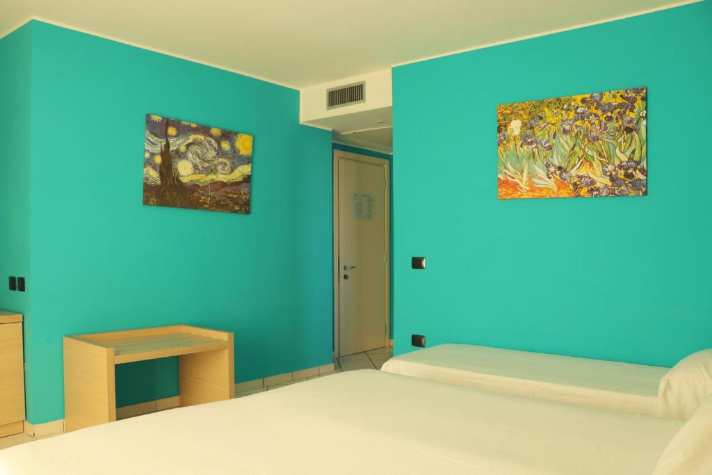 Postel nebo postele na pokoji v ubytování Hotel Ancora