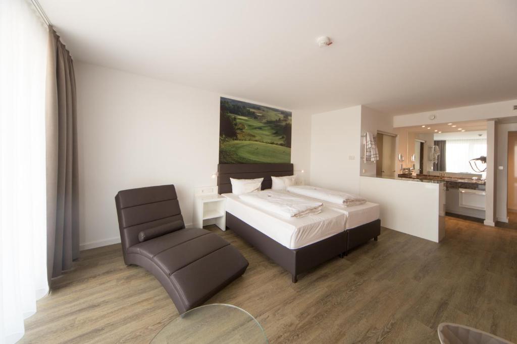 Postel nebo postele na pokoji v ubytování Hotel absolute