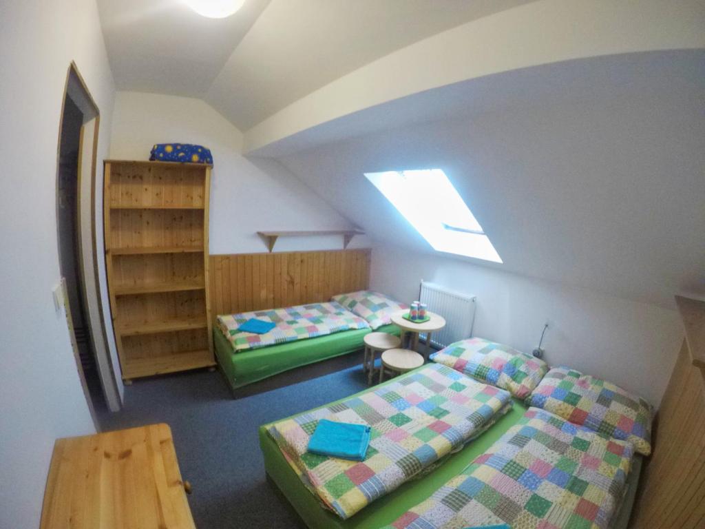 Postel nebo postele na pokoji v ubytování Penzion U Lípy