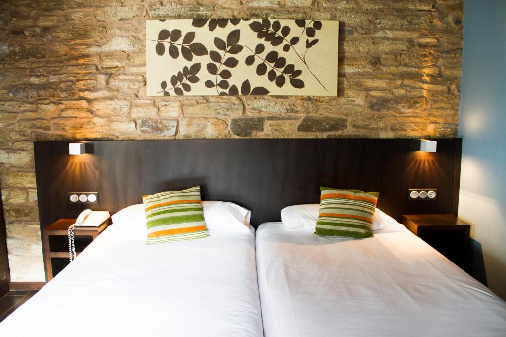 Cama o camas de una habitación en Hotel A Tafona do Peregrino