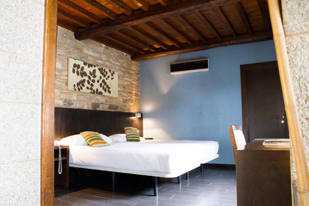 Cama o camas de una habitación en Hotel A Tafona do Peregrino