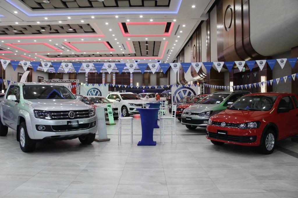 a car showroom with several cars on display at Copantl Hotel & Convention Center in San Pedro Sula