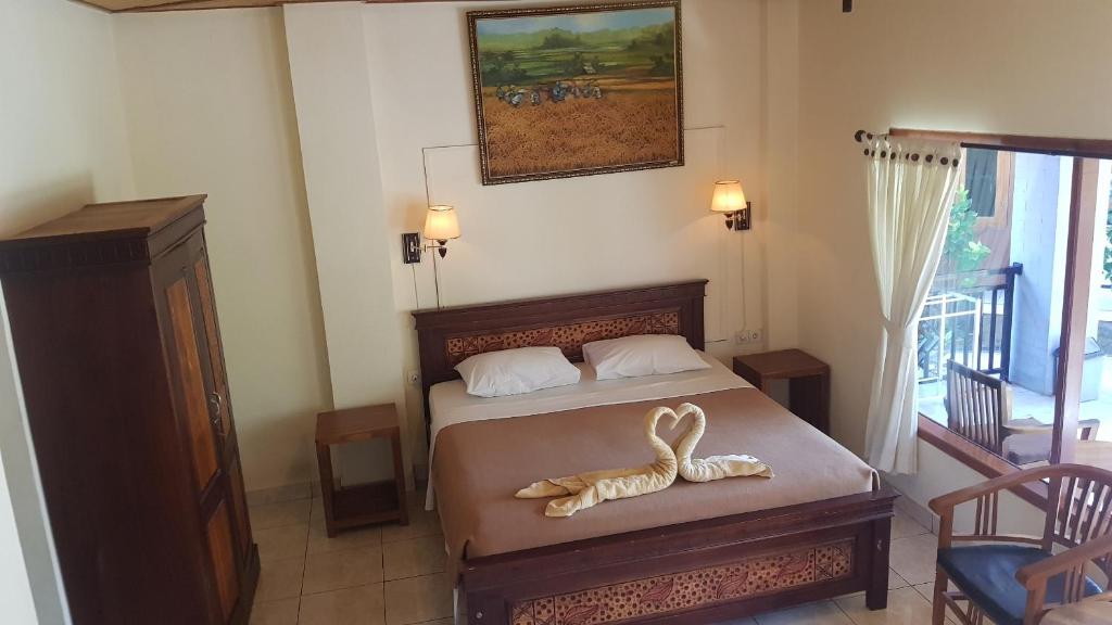 Postel nebo postele na pokoji v ubytování Hotel My Lovina