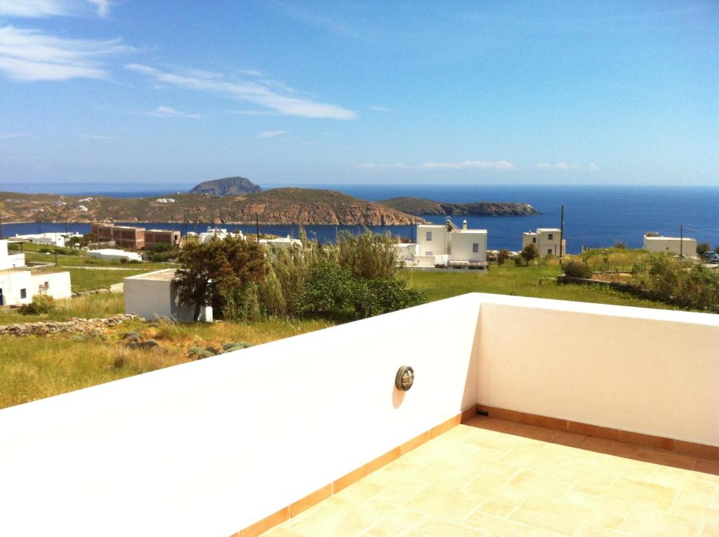 a view of the ocean from the balcony of a house at Gaia Serifos Apartments in Rámos