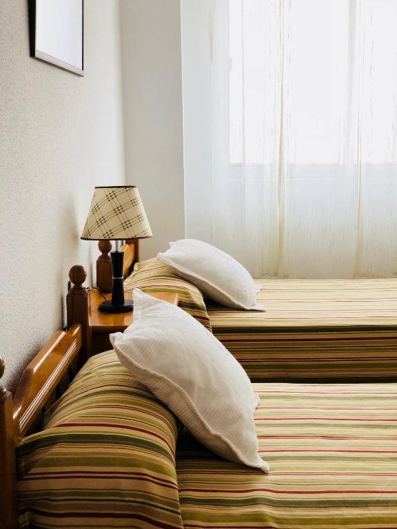 Postel nebo postele na pokoji v ubytování Piso Urbano Garcia De la Cruz