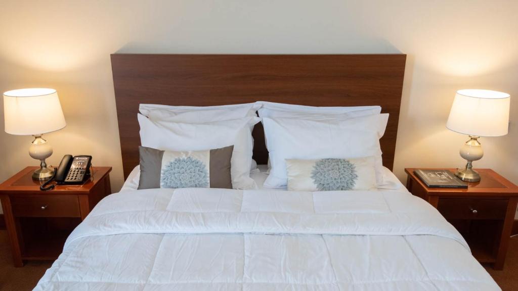 Postel nebo postele na pokoji v ubytování Hotel Kierion