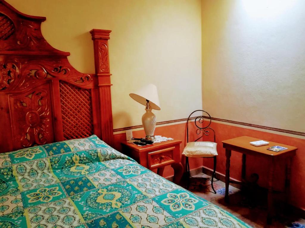 Postel nebo postele na pokoji v ubytování Hotel Posada Maria Bonita