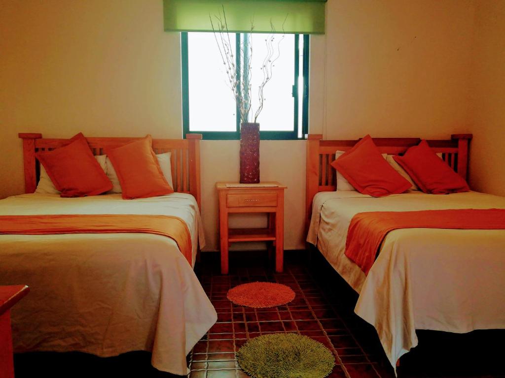 Postel nebo postele na pokoji v ubytování Hotel Real de TX