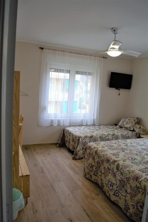 Postel nebo postele na pokoji v ubytování B&B LOS LLANOS