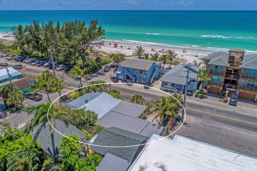 an aerial view of a beach and the ocean at Playa Esmeralda One Bedroom Cottages in Bradenton Beach