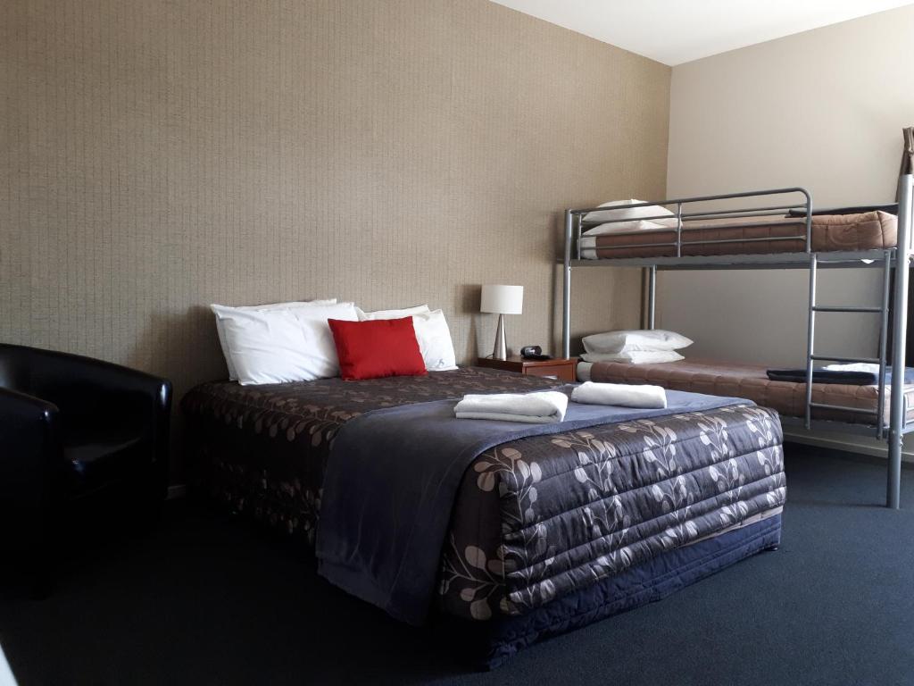 Postel nebo postele na pokoji v ubytování Northpark Motel