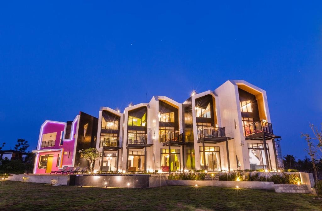 a large building with lights in the night at Peekaboo in Xiaoliuqiu