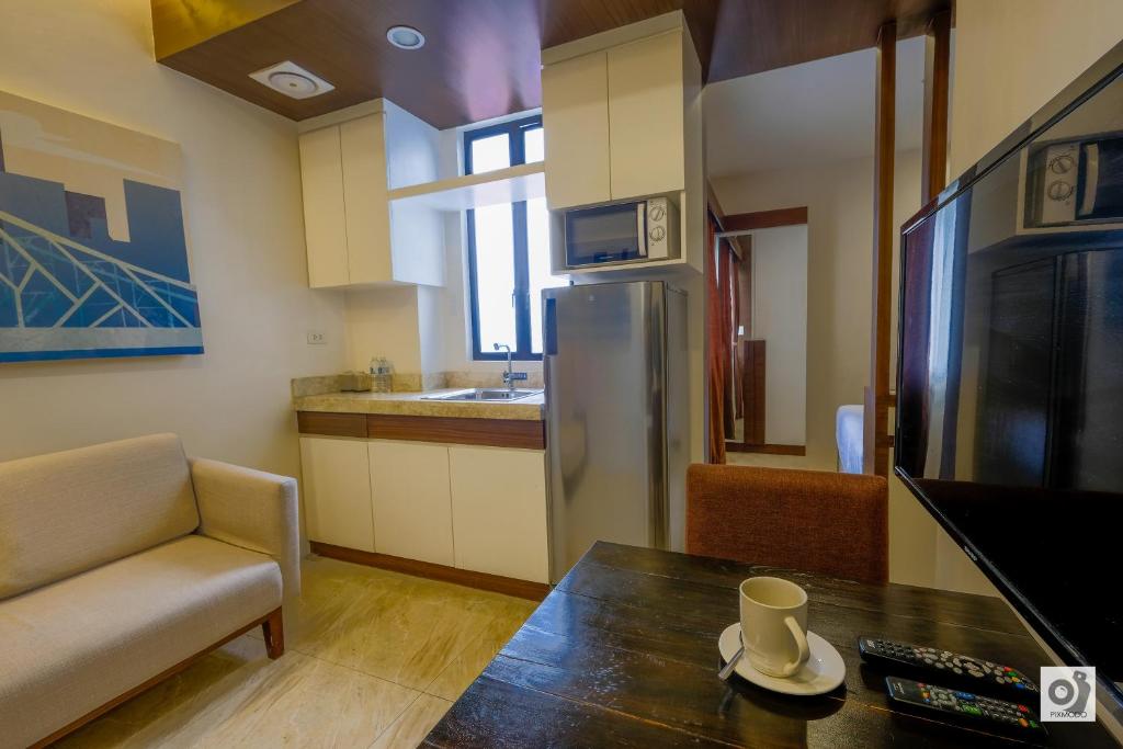 TV a/nebo společenská místnost v ubytování Bed and Bath Serviced Suites