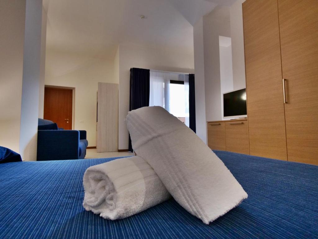 Postel nebo postele na pokoji v ubytování Hotel Residence Mondial