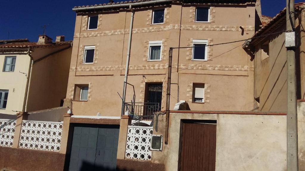 a large building with a gate in front of it at Hispanoconcucense in Teruel