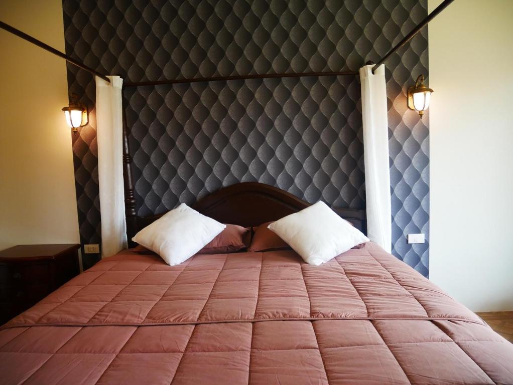 Postel nebo postele na pokoji v ubytování Tinna Resort