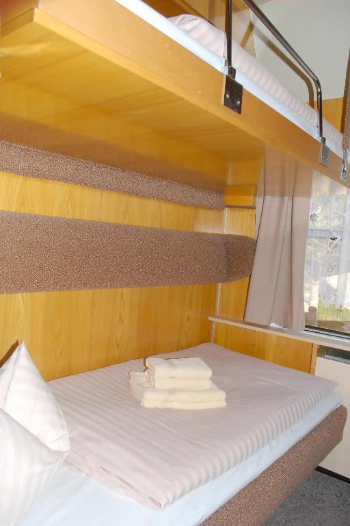 Postel nebo postele na pokoji v ubytování Wolkensteiner Zughotel