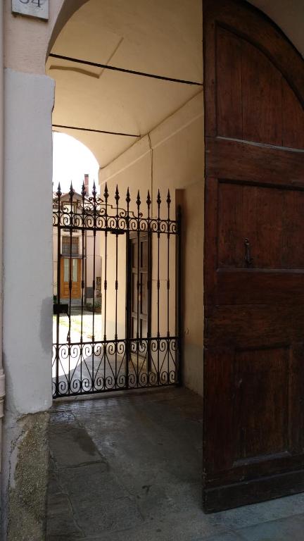 an entrance to a building with a iron gate at Cardano in Pavia