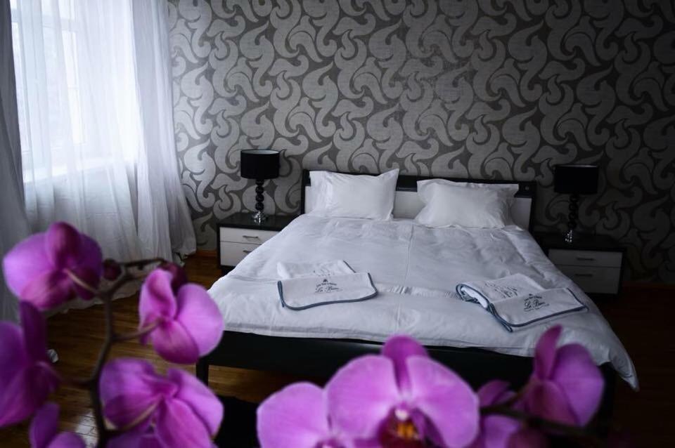 Łóżko lub łóżka w pokoju w obiekcie Villa Romeo