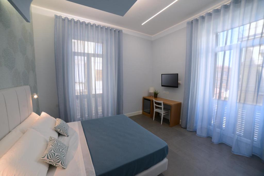 Televízia a/alebo spoločenská miestnosť v ubytovaní In Centro B&B