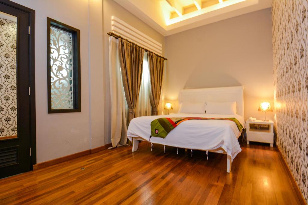 Postel nebo postele na pokoji v ubytování Jonker Boutique Hotel