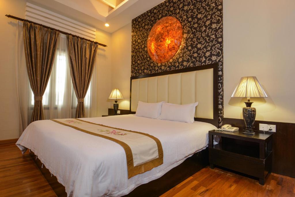 Postel nebo postele na pokoji v ubytování Jonker Boutique Hotel