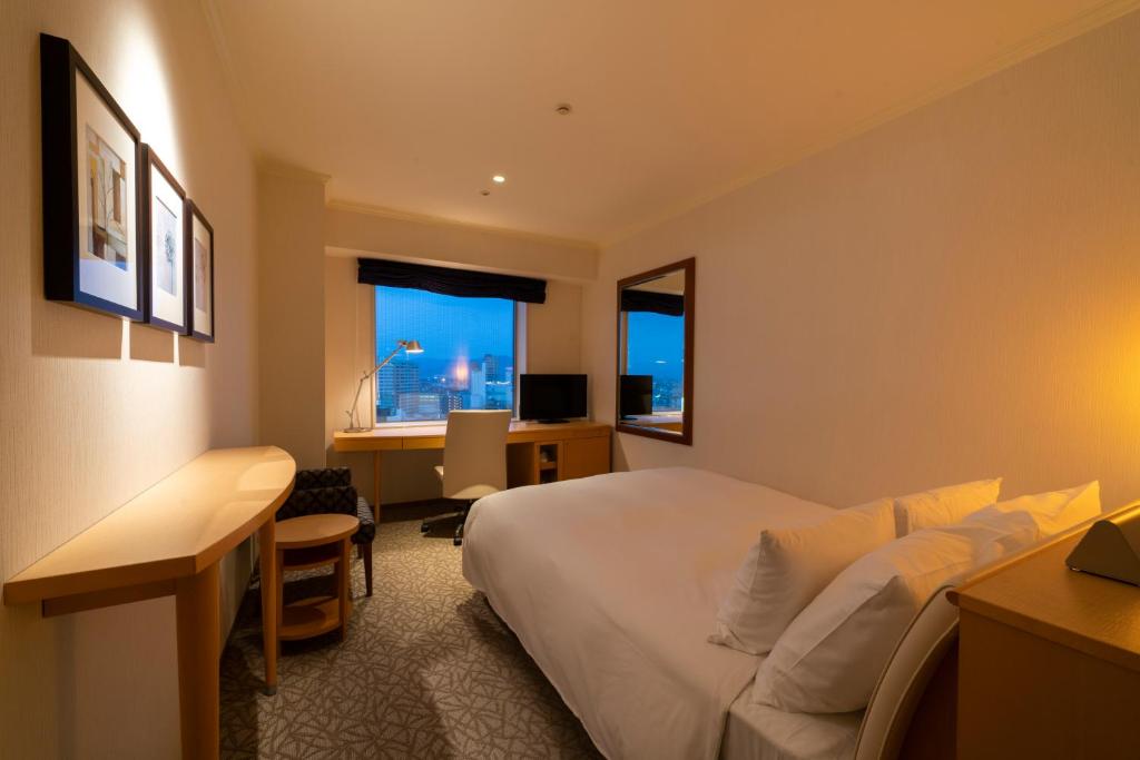 TV a/nebo společenská místnost v ubytování Hotel Associa Toyohashi