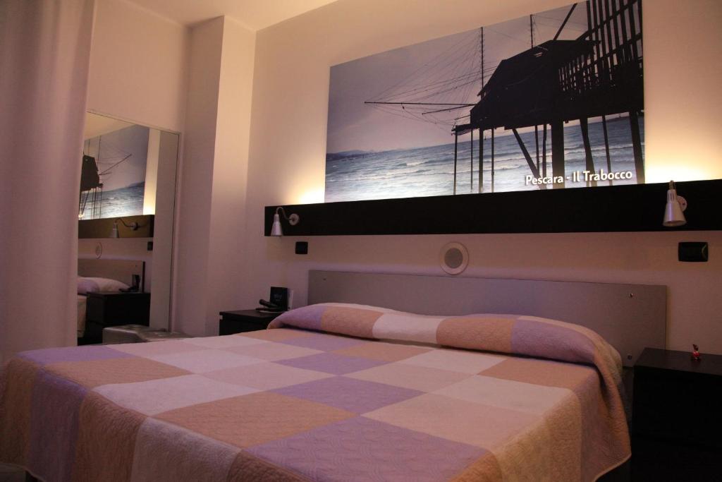 Postel nebo postele na pokoji v ubytování Bella Pescara B&B