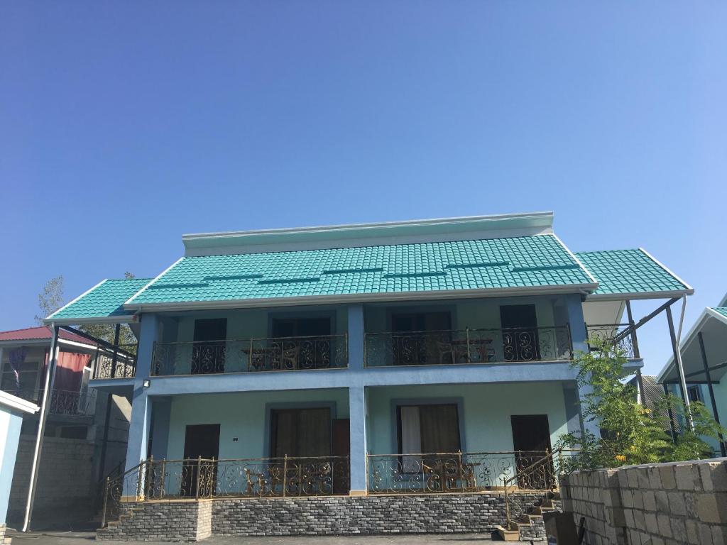 a house with a green roof on top of it at Emerald House Gabala in Gabala