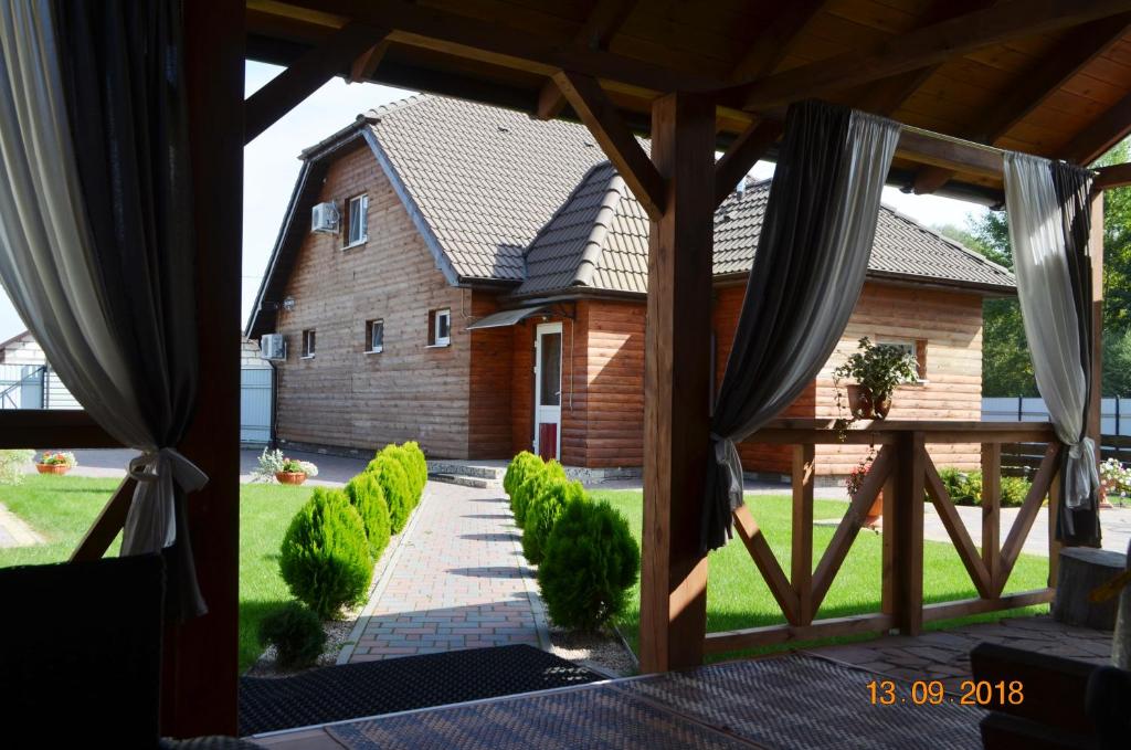 a view of a house from a window at Country House v Kleynikah in Brest