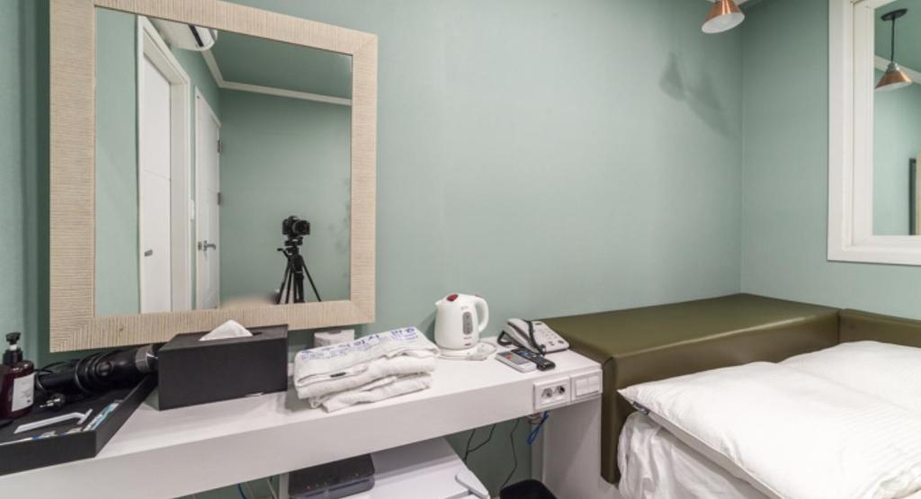 Postel nebo postele na pokoji v ubytování Inn Hotel