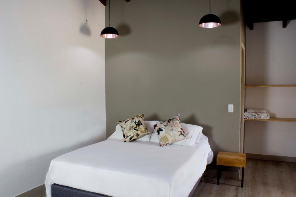 Postel nebo postele na pokoji v ubytování Hotel Boutique Plaza