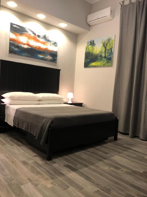 Postel nebo postele na pokoji v ubytování Caio Duilio B&B