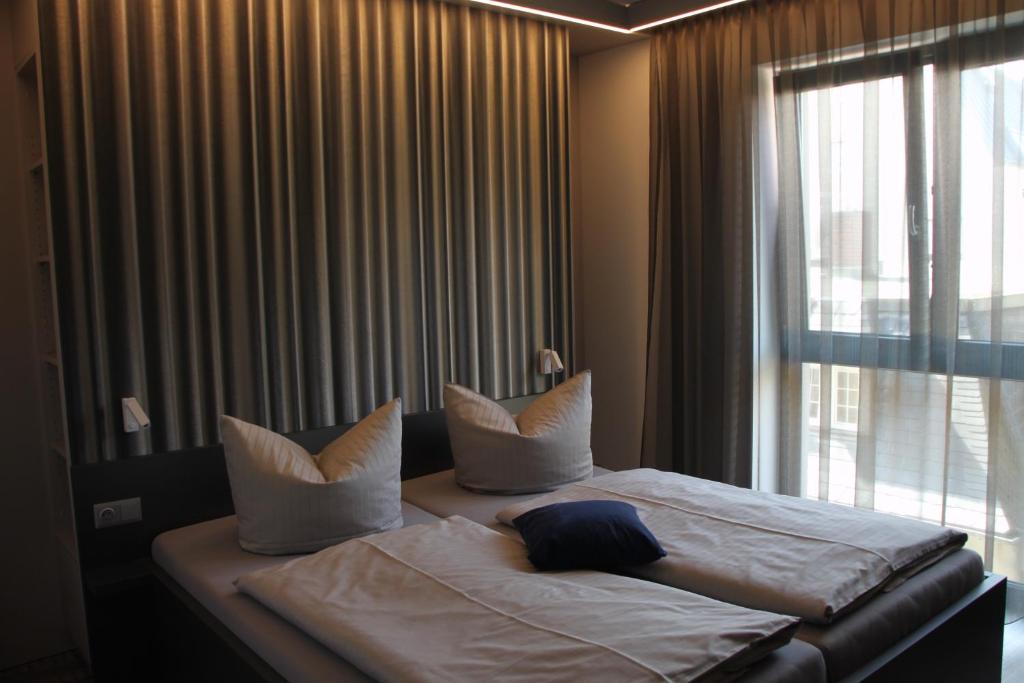 Postel nebo postele na pokoji v ubytování Hotel Eulensteins