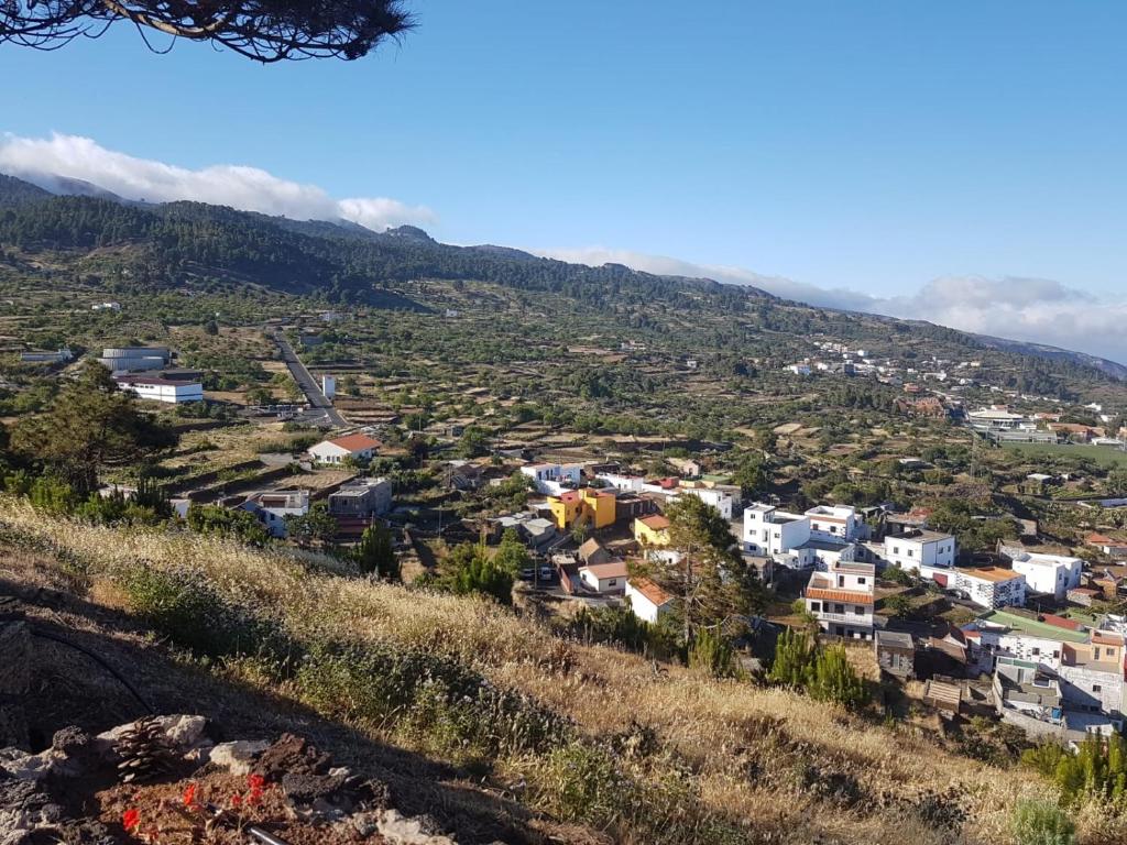 a view of a town on a hill at Casa rural meridiano in El Pinar del Hierro