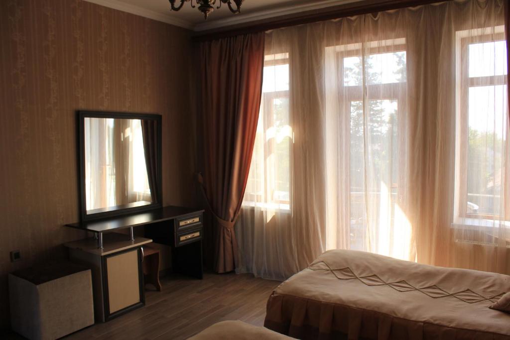 Gulta vai gultas numurā naktsmītnē Ivanovka Guest House
