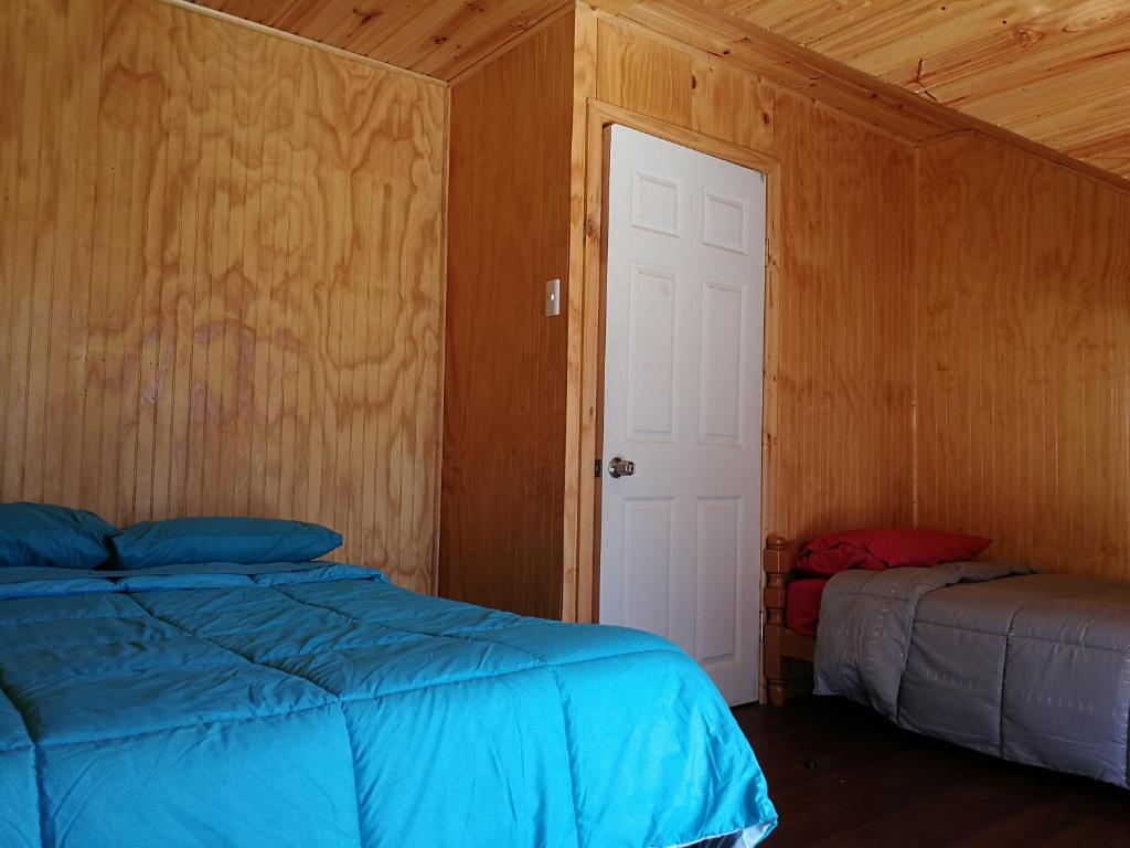 Postel nebo postele na pokoji v ubytování Camping & Hospedaje Rio Laja