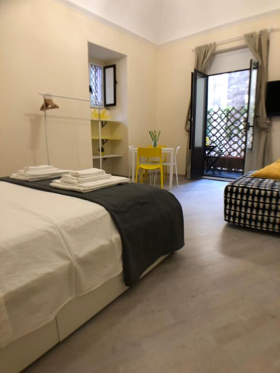 A bed or beds in a room at Catania Sun&Sea - Sun Home