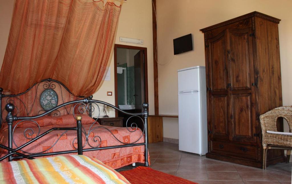 Posteľ alebo postele v izbe v ubytovaní Agriturismo Ghiritina