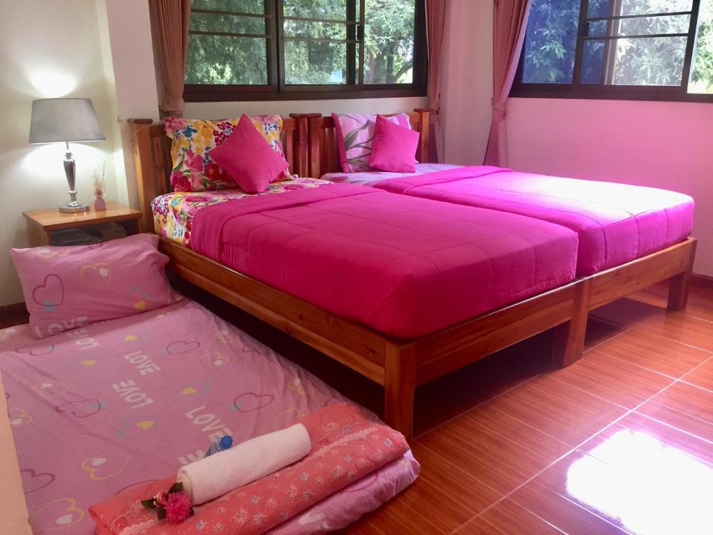 Postel nebo postele na pokoji v ubytování Yayee Homestay