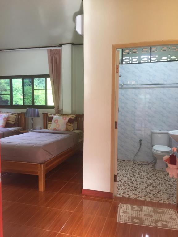 Postel nebo postele na pokoji v ubytování Yayee Homestay