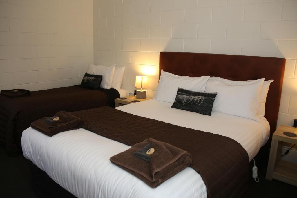 Postel nebo postele na pokoji v ubytování Mackenzie Motels
