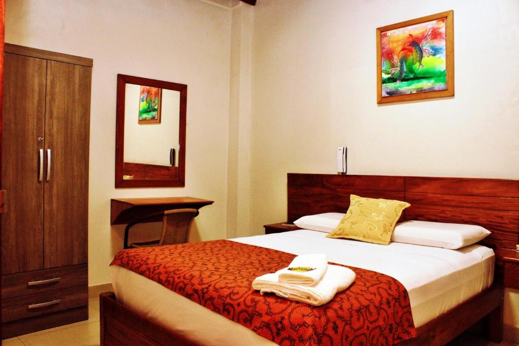 Posteľ alebo postele v izbe v ubytovaní Hostal Macambo