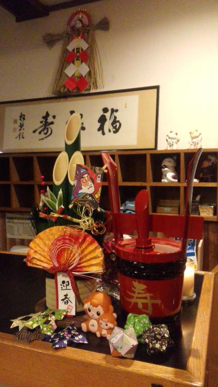a counter top with a red blender and someinese objects at Sakka Sanso in Hakuba